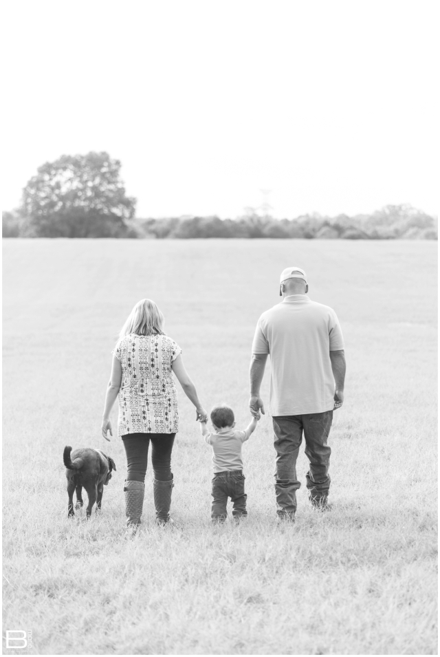 Kingwood family photographer maternity and family session in open field with 2 year old boy